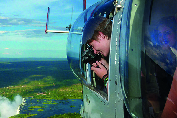 Board a helicopter and soar above the iconic Victoria Falls, marveling at the majestic sight from a breathtaking 180-degree perspective. Feel the rush of wind as you hover over the cascading waters, witnessing the sheer power and beauty of one of the world's most renowned natural wonders unfold beneath you. Board a helicopter and soar above the iconic Victoria Falls, marveling at the majestic sight from a breathtaking 180-degree perspective. Feel the rush of wind as you hover over the cascading waters, witnessing the sheer power and beauty of one of the world's most renowned natural wonders unfold beneath you.