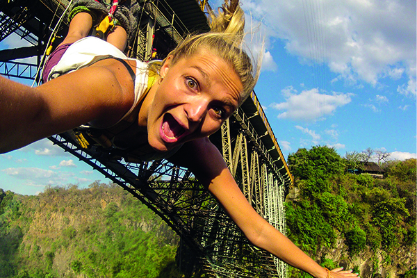 In the heart of Africa adventures at Victoria Falls, Zimbabwe, a courageous lady takes on the ultimate adrenaline rush: the gorge swing. With a sheer drop from the top of the gorge, she embraces the exhilaration, feeling the rush of freedom as she swings over the breathtaking abyss. In the heart of Africa adventures at Victoria Falls, Zimbabwe, a courageous lady takes on the ultimate adrenaline rush: the gorge swing. With a sheer drop from the top of the gorge, she embraces the exhilaration, feeling the rush of freedom as she swings over the breathtaking abyss.
